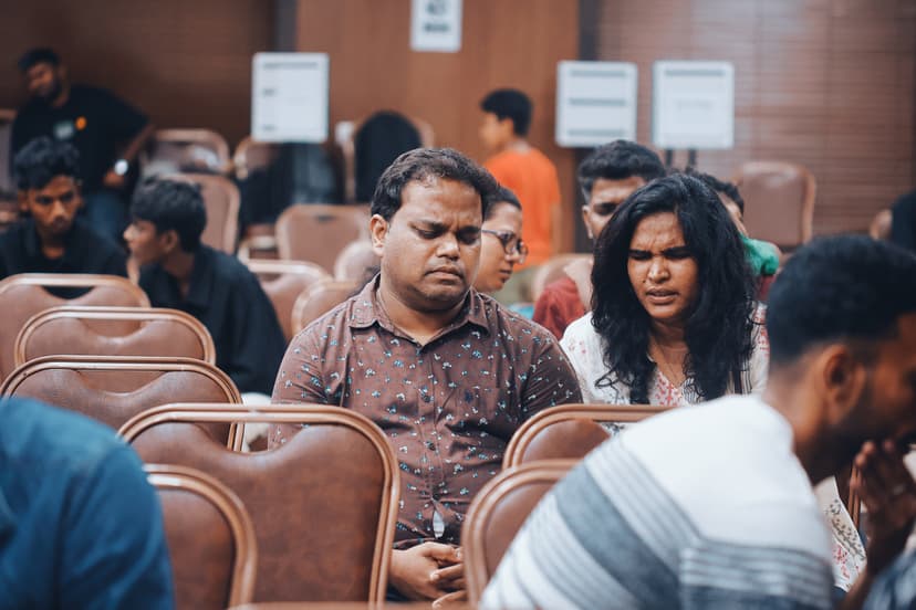 Young people praying together