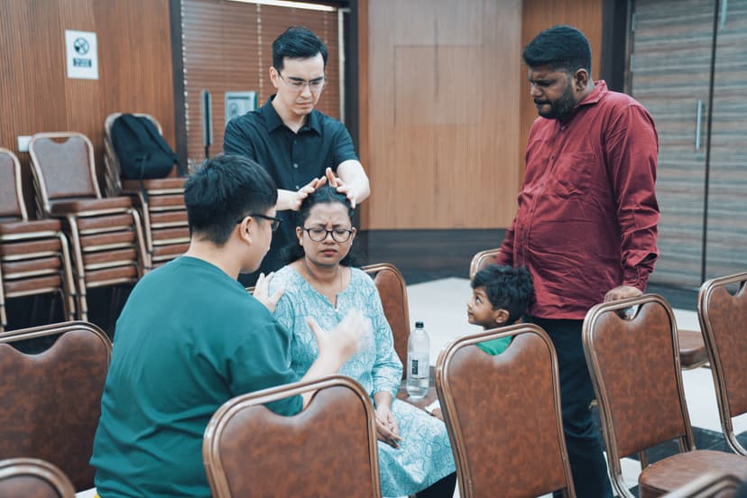 People raising hands in worship
